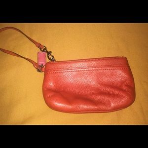 Coach burnt orange clutch/wallet.Great condition.